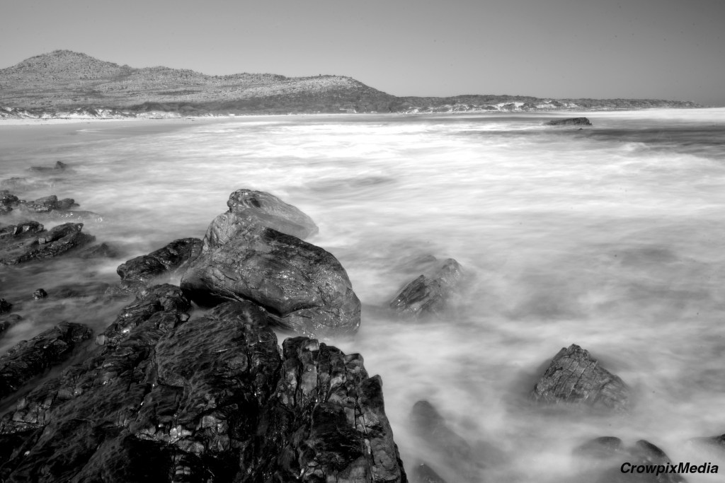 The photo above demonstrates the effects of ND filters. A slow shutter speed creates a milky impact on the water flow. I used an ND filter and slowed the shutter down to achieve the blurry effect seen in the water in the midday sun. The natural colour of the scene above has helped convert this image into an appealing black and white photograph. Photo by Crowpix Media.