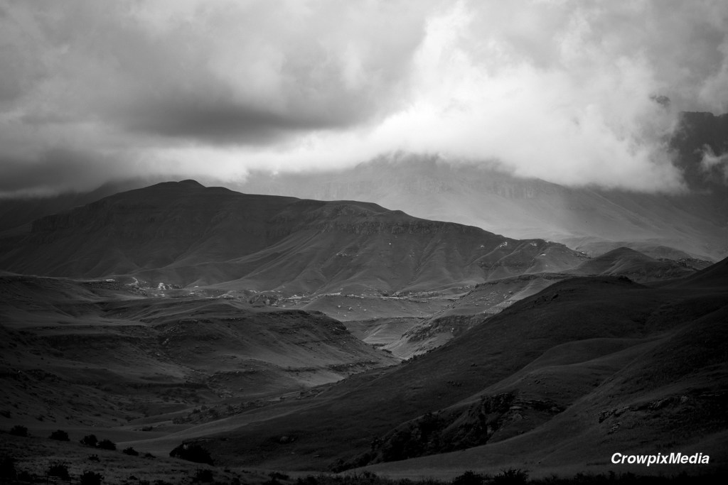 The cloudy weather pictured above creates a gloomy mood in this black and white nature image. Photo by Crowpix Media.