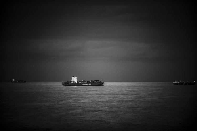 alt="black and white photograph of a ship on the ocean in Natal South Africa. Seascape photography"