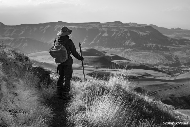 alt="A person in a mountainous landscape photo scene. Include interesting elements in your landscape composition such as a person shown in the photo above."